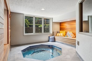 Ultimate luxury awaits in your own private spa room with custom hot tub and full sized sauna!