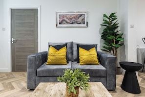 Comfortable Living Space featuring:
-1 large open-plan lounge/kitchen/dining area
-Lounge area near the front window, perfect for natural light and relaxing
-Smart TV with Netflix
-1 x small sofa bed