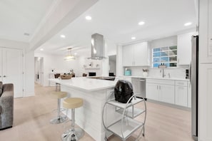 Fully equipped kitchen with large island for cooking and gathering
