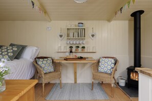 Inside Cotswold Nest - seating area with two arm chairs
