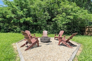 Enjoy a bonfire under stars and relax in comfy Adirondack chairs by the fire.