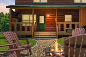 Relax by the fire pit and enjoy the evening air in our cozy cabin setting.
