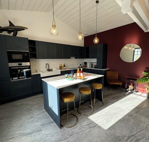 Kitchen opening onto dining room 