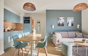 Experience modern coastal living in this vibrant 1-bedroom apartment featuring an airy living space with a cozy pull-out sofa and a smart kitchenette, perfect for a beach getaway in Mimizan.