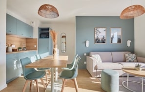 Experience modern coastal living in this vibrant 1-bedroom apartment featuring an airy living space with a cozy pull-out sofa and a smart kitchenette, perfect for a beach getaway in Mimizan.