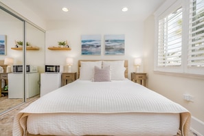 Unwind in this beautifully designed coastal retreat, perfect for solo travelers or couples. This stylish, serene space features a plush queen-size bed with linens, soft lighting, and elegant ocean-themed.