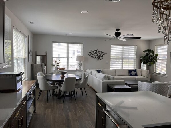 Open-concept living and dining area with plenty of natural light, perfect for relaxing or entertaining.