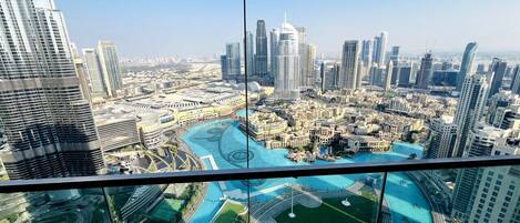 Panoramic balcony view of the Burj Khalifa, Dubai Fountain, and Downtown skyline