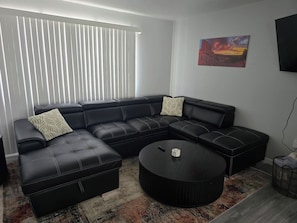 Leather sectional which turns into a sleeper