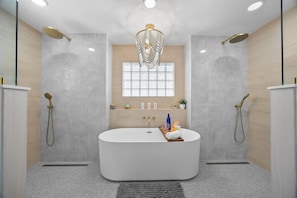 Spa Retreat: Indulge in luxury with a soaking tub and dual rain showers for ultimate relaxation!