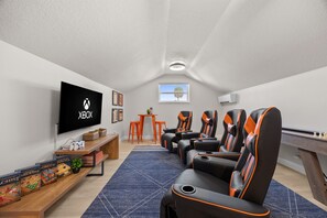 Game Room: Unleash your competitive spirit in our sleek gaming paradise—fun awaits!