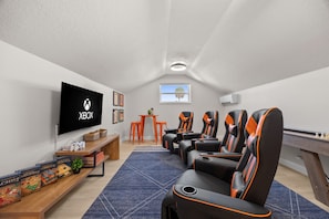 Game Room: Unleash your competitive spirit in our sleek gaming paradise—fun awaits!