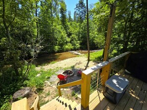 Relax on the deck overlooking creek
