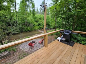 From deck, looking at fire pit & the creek