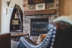 Relax by the fireplace and enjoy a family movie night | Main Level