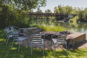 Share a fire with your group and take in the Whitefish River views | Exterior