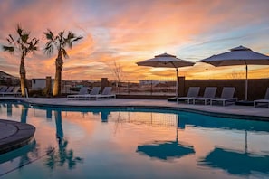 Poolside Loungers & Palms in Sunset Glow