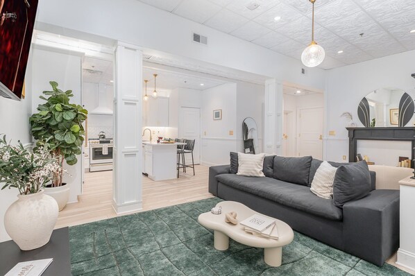 Open-Concept Living Area featuring designer furnishings, and a Smart TV.