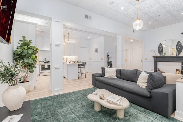 Open-Concept Living Area featuring designer furnishings, and a Smart TV.