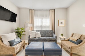 Heritage-style living space with streaming TV and comfy furnishings.