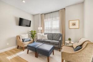 Cozy living room with Roku TV, soft textures, and natural light.