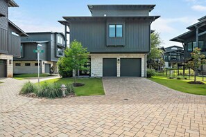 Escape to this modern Lake Travis retreat featuring an open layout, gourmet kitchen, cozy loft, and game room with a pool table.