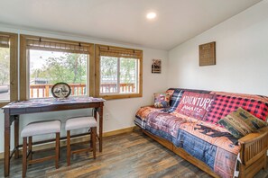 Living Area | Queen Futon | 2-Person Dining Table | Free WiFi