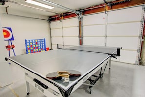 In the garage, enjoy a ping pong game and a variety of other games for endless family fun and entertainment.