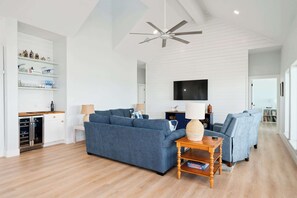 Your perfect hangout spot – plush seating, soft lighting, and a wet bar ready for happy hour.