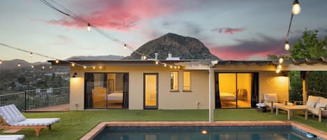 Stunning sunset shot of the house and pool.