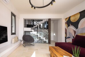 Natural light fills this high-end heart of the home featuring a 55' Smart TV.