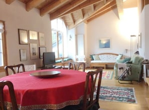 Living room with dining room, lounge and access to the terrace
