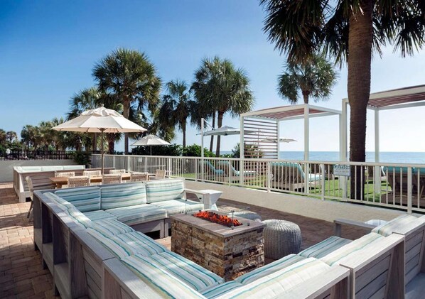 The Strand - Outdoor Sitting Area With Fire Pit