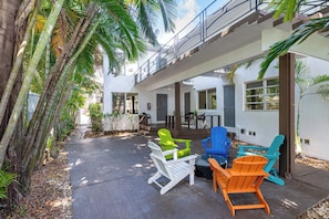 Unwind on patio furniture while taking in the serene canal views