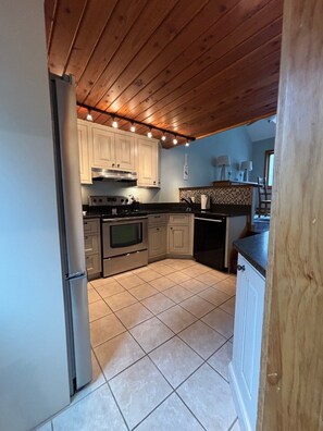 Few Steps up from the entry way is the Kitchen