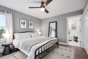 King bed with memory foam mattress and plush bedding