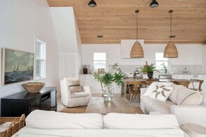 WOW! Bright and airy - fully renovated. Living room with soaring ceilings!