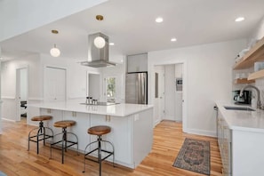 Fully Updated Kitchen with Quartz Counters and Upgraded Appliances. Cooktop, Oven, Dishwasher, Refrigerator and Microwave