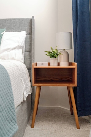 Nightstand includes an outlet hub with standard plugs, USB-A, USB-C ports.