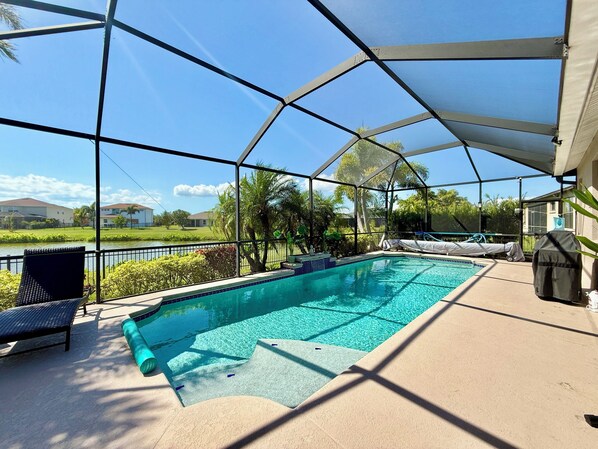 Your view: a large sparkling pool, a beautiful landscape and a serene lake.