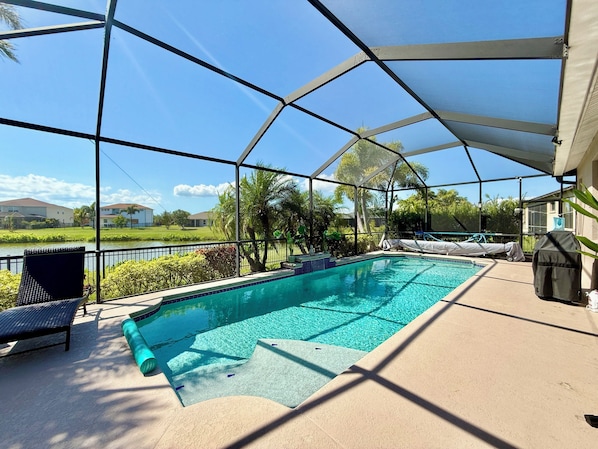 Your view: a large sparkling pool, a beautiful landscape and a serene lake.