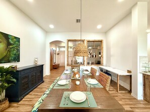 Dining area features:A tropical-inspired table that seat 6.A dedicated workspace