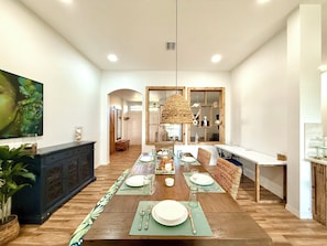 Dining area features:A tropical-inspired table that seat 6.A dedicated workspace