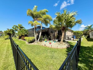 Your view: a large sparkling pool, a beautiful landscape and a serene lake.