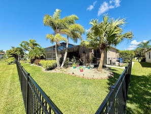Your view: a large sparkling pool, a beautiful landscape and a serene lake.