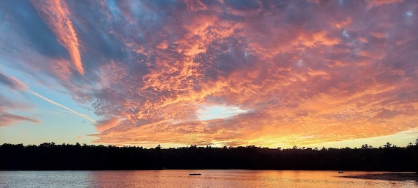 View of clear lake at sunset.