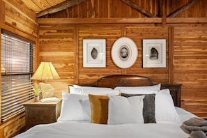 King bed with luxurious bedding and plush pillows for a restful stay.