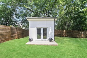ADU - Dedicated Home Office with 55'inch screen perfect for conference calls. Comes with whiteboard and 27" monitor and an adjustable stand up desk.