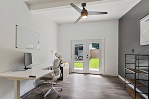 Dedicated Home Office with 55'inch screen perfect for conference calls. Comes with whiteboard and 27" monitor and an adjustable stand up desk.