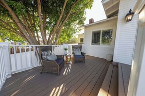 Enjoy the outdoors on our serene patio. Private deck overlooks the neighborhood and makes for a great place to take tea in the morning sunrise, or wine with the sunset. This Patio also overlooks the lush landscape of the front terrace. 